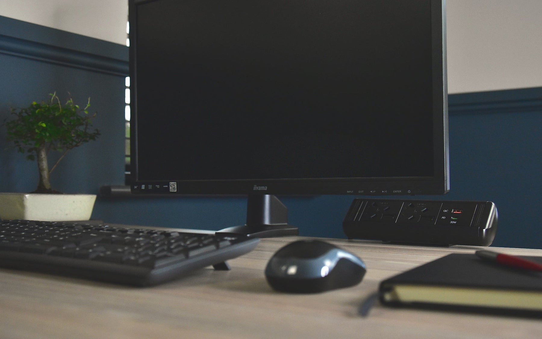 Desk power unit installed on a modern office workstation